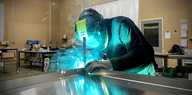 Fabricator welding returns to Tray Sign
